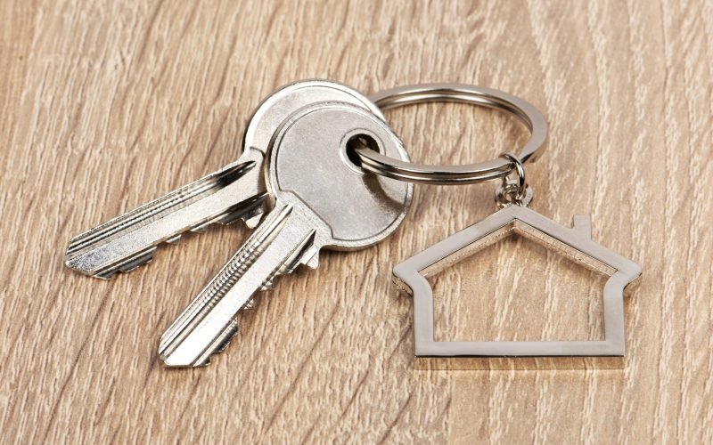 House shaped keychain with two keys